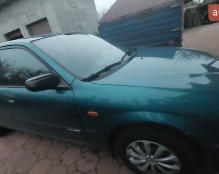 Синий Мазда 323, объемом двигателя 1.5 л и пробегом 280 тыс. км за 2700 $, фото 4 на Automoto.ua