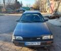 Синий Мазда 323, объемом двигателя 1.49 л и пробегом 314 тыс. км за 1000 $, фото 1 на Automoto.ua