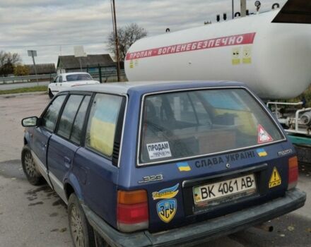 Синий Мазда 323, объемом двигателя 1.5 л и пробегом 100 тыс. км за 715 $, фото 2 на Automoto.ua