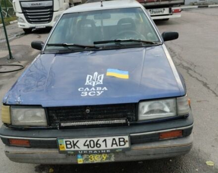 Синий Мазда 323, объемом двигателя 1.5 л и пробегом 100 тыс. км за 715 $, фото 1 на Automoto.ua