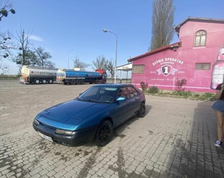 Синий Мазда 323, объемом двигателя 1 л и пробегом 357 тыс. км за 1500 $, фото 1 на Automoto.ua