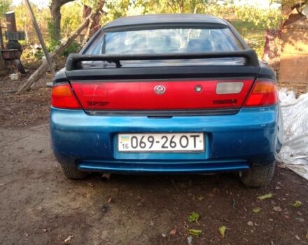 Синий Мазда 323, объемом двигателя 1.8 л и пробегом 345 тыс. км за 700 $, фото 1 на Automoto.ua
