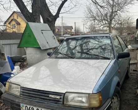 Синий Мазда 323, объемом двигателя 1.5 л и пробегом 293 тыс. км за 400 $, фото 1 на Automoto.ua
