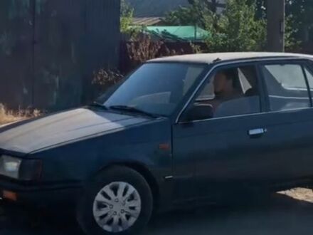 Синій Мазда 323, об'ємом двигуна 1.3 л та пробігом 200 тис. км за 477 $, фото 1 на Automoto.ua
