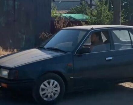 Синій Мазда 323, об'ємом двигуна 1.3 л та пробігом 200 тис. км за 477 $, фото 1 на Automoto.ua