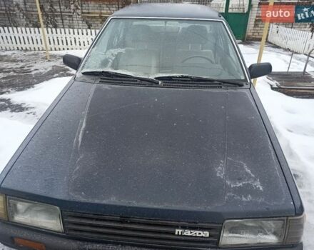 Синій Мазда 323, об'ємом двигуна 1.3 л та пробігом 223 тис. км за 1199 $, фото 1 на Automoto.ua