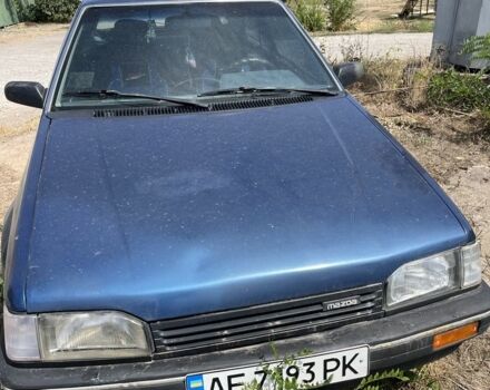 Синій Мазда 323, об'ємом двигуна 1.5 л та пробігом 300 тис. км за 1100 $, фото 1 на Automoto.ua