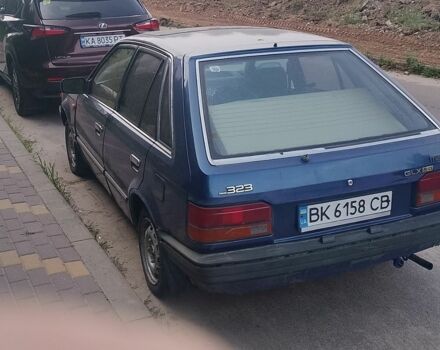 Синий Мазда 323, объемом двигателя 1.6 л и пробегом 300 тыс. км за 337 $, фото 1 на Automoto.ua
