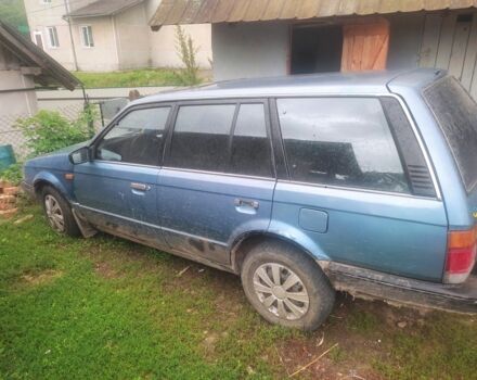 Синій Мазда 323, об'ємом двигуна 1 л та пробігом 3 тис. км за 850 $, фото 1 на Automoto.ua