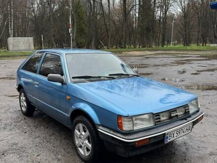 Синий Мазда 323, объемом двигателя 1.32 л и пробегом 220 тыс. км за 950 $, фото 1 на Automoto.ua