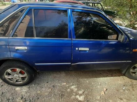 Синій Мазда 323, об'ємом двигуна 1.3 л та пробігом 378 тис. км за 950 $, фото 1 на Automoto.ua