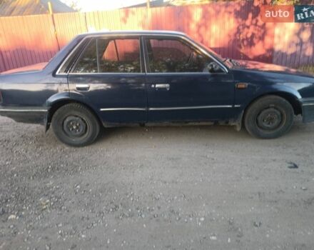 Синий Мазда 323, объемом двигателя 1.72 л и пробегом 300 тыс. км за 1000 $, фото 1 на Automoto.ua