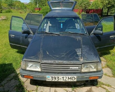 Синий Мазда 323, объемом двигателя 1.7 л и пробегом 400 тыс. км за 600 $, фото 1 на Automoto.ua