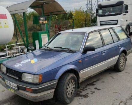 Синий Мазда 323, объемом двигателя 1.5 л и пробегом 100 тыс. км за 715 $, фото 1 на Automoto.ua