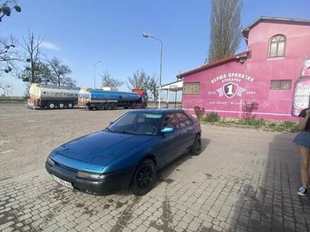 Синій Мазда 323, об'ємом двигуна 1 л та пробігом 357 тис. км за 1800 $, фото 1 на Automoto.ua