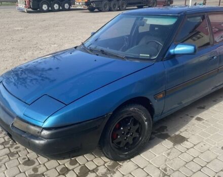 Синий Мазда 323, объемом двигателя 1 л и пробегом 357 тыс. км за 1500 $, фото 1 на Automoto.ua