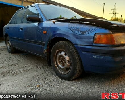 Синий Мазда 323, объемом двигателя 1.6 л и пробегом 234 тыс. км за 400 $, фото 1 на Automoto.ua