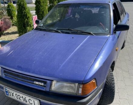 Синій Мазда 323, об'ємом двигуна 1.6 л та пробігом 250 тис. км за 602 $, фото 1 на Automoto.ua