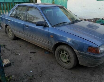 Синий Мазда 323, объемом двигателя 1.3 л и пробегом 323 тыс. км за 557 $, фото 1 на Automoto.ua