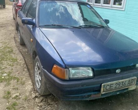 Синий Мазда 323, объемом двигателя 1 л и пробегом 427 тыс. км за 720 $, фото 1 на Automoto.ua