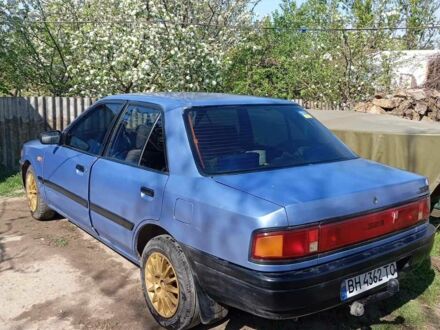Синій Мазда 323, об'ємом двигуна 1.3 л та пробігом 322 тис. км за 1000 $, фото 1 на Automoto.ua