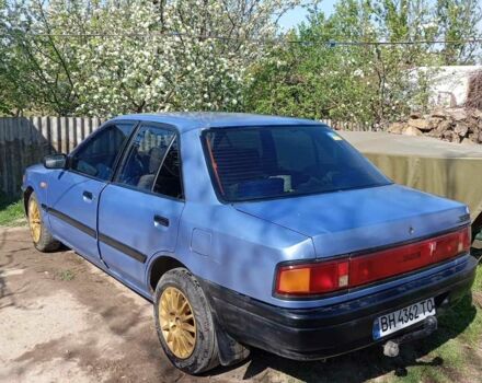 Синий Мазда 323, объемом двигателя 1.3 л и пробегом 322 тыс. км за 1000 $, фото 1 на Automoto.ua