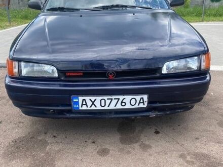 Синий Мазда 323, объемом двигателя 1.32 л и пробегом 259 тыс. км за 1100 $, фото 1 на Automoto.ua