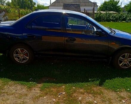 Синий Мазда 323, объемом двигателя 1.3 л и пробегом 429 тыс. км за 2100 $, фото 1 на Automoto.ua