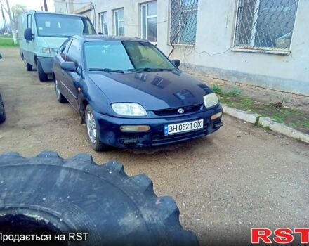 Синій Мазда 323, об'ємом двигуна 1.3 л та пробігом 330 тис. км за 1250 $, фото 1 на Automoto.ua