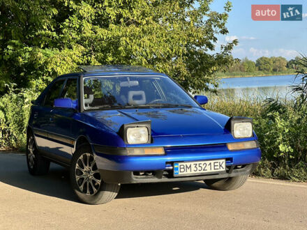 Синий Мазда 323, объемом двигателя 1.8 л и пробегом 435 тыс. км за 3400 $, фото 1 на Automoto.ua
