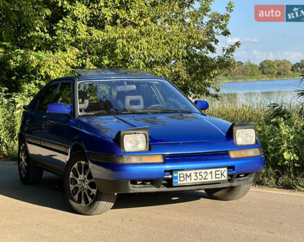 Синий Мазда 323, объемом двигателя 1.8 л и пробегом 435 тыс. км за 3400 $, фото 1 на Automoto.ua