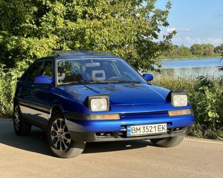 Синий Мазда 323, объемом двигателя 1.8 л и пробегом 435 тыс. км за 3400 $, фото 1 на Automoto.ua