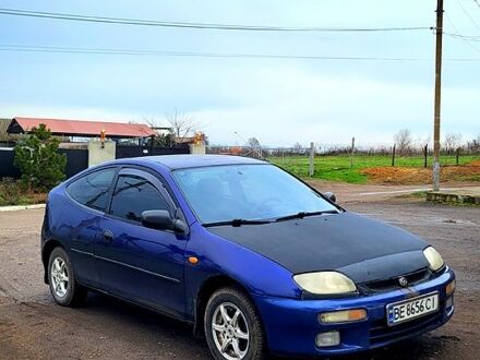 Синий Мазда 323, объемом двигателя 1.3 л и пробегом 200 тыс. км за 1150 $, фото 1 на Automoto.ua