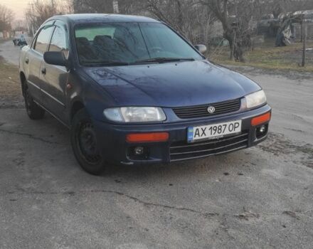 Синий Мазда 323, объемом двигателя 1.8 л и пробегом 352 тыс. км за 1500 $, фото 1 на Automoto.ua