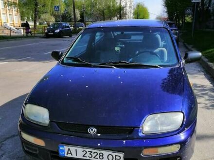 Синий Мазда 323, объемом двигателя 1.5 л и пробегом 212 тыс. км за 2100 $, фото 1 на Automoto.ua