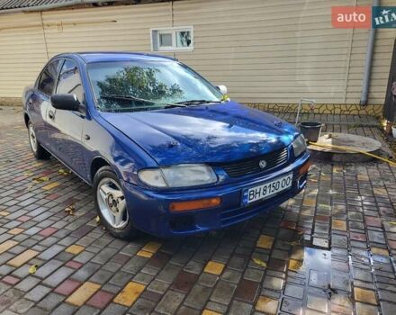 Синий Мазда 323, объемом двигателя 1.49 л и пробегом 350 тыс. км за 1499 $, фото 1 на Automoto.ua