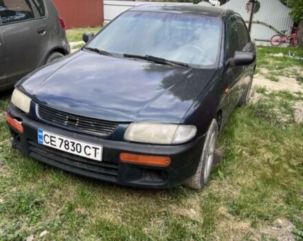 Синій Мазда 323, об'ємом двигуна 1.3 л та пробігом 300 тис. км за 2400 $, фото 1 на Automoto.ua
