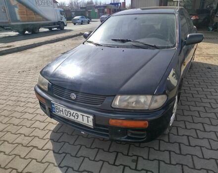 Синий Мазда 323, объемом двигателя 1.3 л и пробегом 287 тыс. км за 1700 $, фото 1 на Automoto.ua