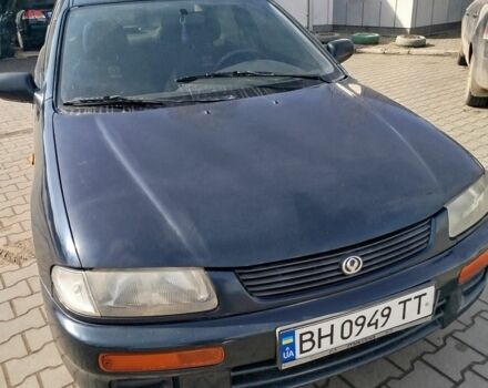 Синій Мазда 323, об'ємом двигуна 1.3 л та пробігом 287 тис. км за 2000 $, фото 1 на Automoto.ua