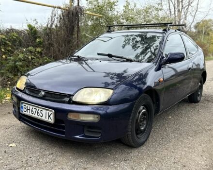 Синій Мазда 323, об'ємом двигуна 1.5 л та пробігом 200 тис. км за 1000 $, фото 1 на Automoto.ua