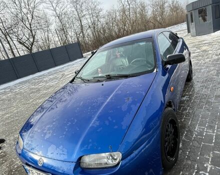 Синий Мазда 323, объемом двигателя 1.5 л и пробегом 250 тыс. км за 2500 $, фото 1 на Automoto.ua