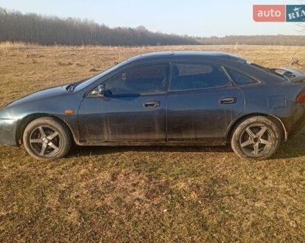 Синий Мазда 323, объемом двигателя 1.5 л и пробегом 200 тыс. км за 1500 $, фото 1 на Automoto.ua