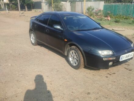 Синий Мазда 323, объемом двигателя 1.5 л и пробегом 400 тыс. км за 1169 $, фото 1 на Automoto.ua