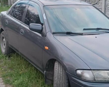 Синий Мазда 323, объемом двигателя 1.8 л и пробегом 50 тыс. км за 1600 $, фото 1 на Automoto.ua