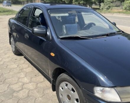 Синій Мазда 323, об'ємом двигуна 1.5 л та пробігом 1000 тис. км за 1100 $, фото 1 на Automoto.ua
