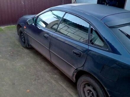 Синий Мазда 323, объемом двигателя 1.5 л и пробегом 235 тыс. км за 1600 $, фото 1 на Automoto.ua