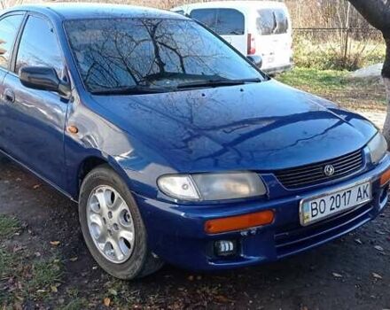 Синий Мазда 323, объемом двигателя 1.5 л и пробегом 400 тыс. км за 1300 $, фото 1 на Automoto.ua