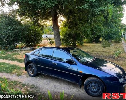 Синий Мазда 323, объемом двигателя 1.5 л и пробегом 348 тыс. км за 2000 $, фото 1 на Automoto.ua
