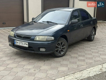 Синій Мазда 323, об'ємом двигуна 1.5 л та пробігом 333 тис. км за 1375 $, фото 1 на Automoto.ua