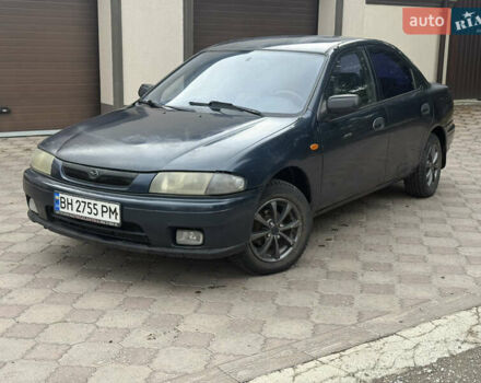 Синий Мазда 323, объемом двигателя 1.5 л и пробегом 333 тыс. км за 1375 $, фото 1 на Automoto.ua